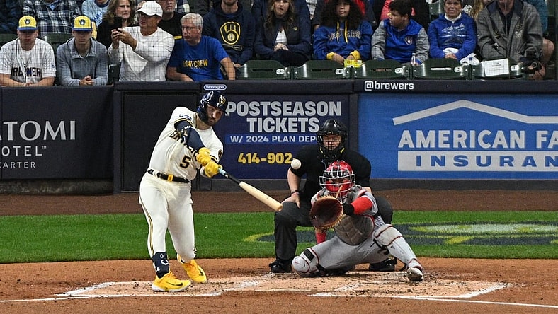 Sep 28, 2023; Milwaukee, Wisconsin, USA; Milwaukee Brewers outfielder Garrett Mitchell (5) hits a double against the St. Louis Cardinals in the fourth inning at American Family Field. Mandatory Credit: Michael McLoone-USA TODAY Sports