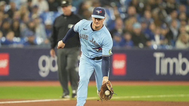 Sep 28, 2023; Toronto, Ontario, CAN; Toronto Blue Jays third baseman Matt Chapman (26) fields a ground ball hit by New York Yankees left fielder Oswaldo Cabrera (not pictured) during the ninth inning at Rogers Centre. Mandatory Credit: John E. Sokolowski-USA TODAY Sports