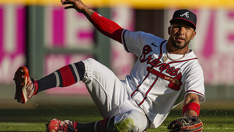Oct 1, 2023; Cumberland, Georgia, USA; Atlanta Braves left fielder Eddie Rosario (8) makes a sliding catch on a ball hit by Washington Nationals shortstop CJ Abrams (5) (not shown) during the eighth inning at Truist Park. Mandatory Credit: Dale Zanine-USA TODAY Sports