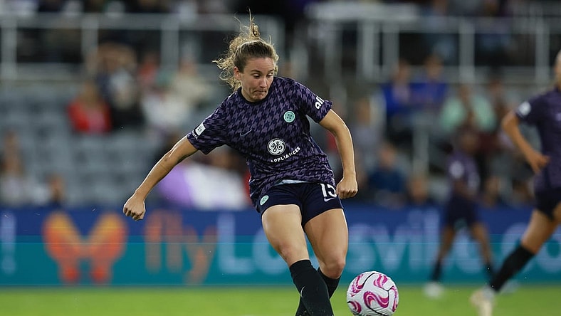 Oct 6, 2023; Louisville, Kentucky, USA; Racing Louisville FC defender Julia Lester (15) passes the ball in the second half against the Orlando Pride at Lynn Family Stadium. Mandatory Credit: EM Dash-USA TODAY Sports