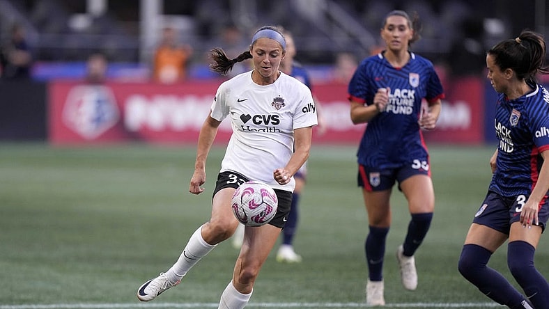 Oct 6, 2023; Seattle, Washington, USA; Washington Spirit forward Ashley Hatch (33) controls the ball as OL Reign defends during the first half at Lumen Field. Mandatory Credit: Stephen Brashear-USA TODAY Sports