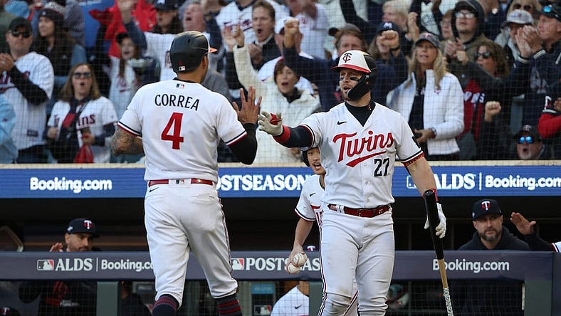 Oct 10, 2023; Minneapolis, Minnesota, USA; Minnesota Twins shortstop Carlos Correa (4) celebrates with catcher Ryan Jeffers (27) after scoring a run in the sixth inning against the Houston Astros during game three of the ALDS for the 2023 MLB playoffs at Target Field. Mandatory Credit: Jesse Johnson-USA TODAY Sports