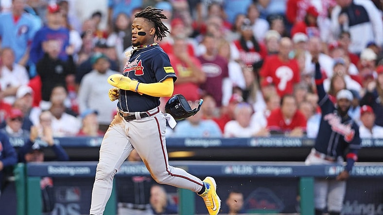 Oct 11, 2023; Philadelphia, Pennsylvania, USA; Atlanta Braves right fielder Ronald Acuna Jr. (13) scores a run on a hit by second baseman Ozzie Albies (not pictured) during the third inning against the Philadelphia Phillies in game three of the NLDS for the 2023 MLB playoffs at Citizens Bank Park. Mandatory Credit: Bill Streicher-USA TODAY Sports
