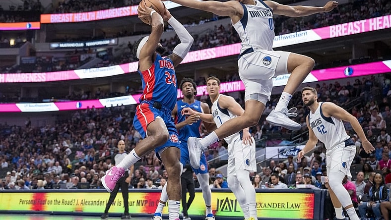 Oct 20, 2023; Dallas, Texas, USA; Dallas Mavericks guard Dante Exum (0) attempts to block a shot by Detroit Pistons guard Zavier Simpson (24) during the second half at the American Airlines Center. Mandatory Credit: Jerome Miron-USA TODAY Sports