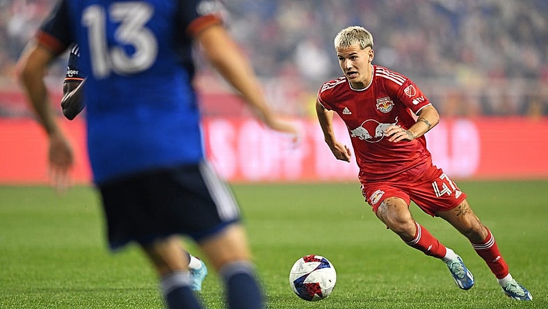 Nov 4, 2023; Harrison, NJ, USA; New York Red Bulls defender John Tolkin (47) controls the ball as FC Cincinnati defender Santiago Arias (13) defends during the first half of game two in a round one match of the 2023 MLS Cup Playoffs at Red Bull Arena. Mandatory Credit: Mark Smith-USA TODAY Sports