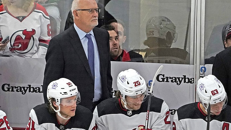 Nov 5, 2023; Chicago, Illinois, USA; New Jersey Devils head coach Lindy Ruff stands behind the bench during the first period at United Center. Mandatory Credit: David Banks-USA TODAY Sports