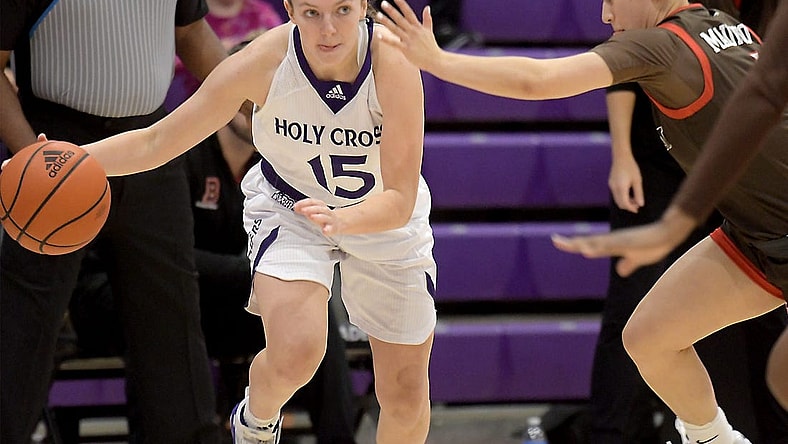 Holy Cross' Cara McCormack moves the ball upcourt as she is defended by Brown's Isabella Mauricio, Thursday, Nov. 9, 2023.