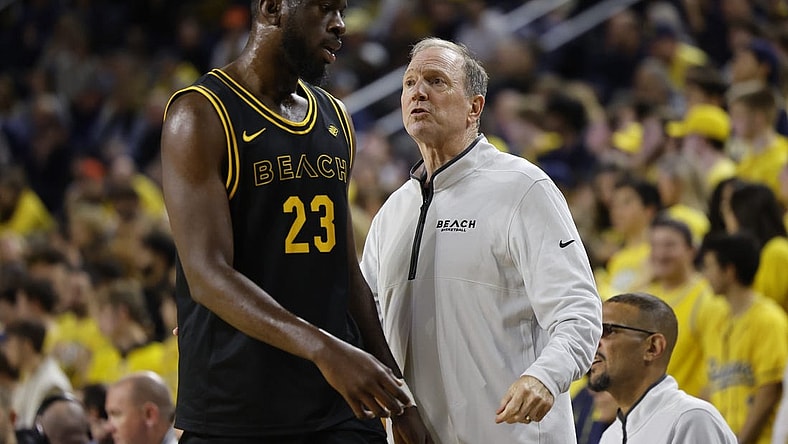 Nov 17, 2023; Ann Arbor, Michigan, USA;  Long Beach State 49ers head coach Dan Monson talks to 49ers forward Lassina Traore (23) in the first half at Crisler Center. Mandatory Credit: Rick Osentoski-USA TODAY Sports