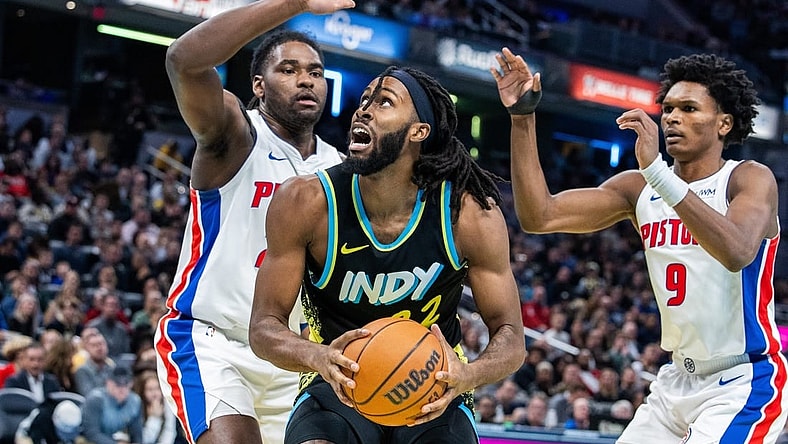 Nov 24, 2023; Indianapolis, Indiana, USA; Indiana Pacers forward Isaiah Jackson (22) shoots the ball while Detroit Pistons center Isaiah Stewart (28) and forward Ausar Thompson (9) defend in the second half at Gainbridge Fieldhouse. Mandatory Credit: Trevor Ruszkowski-USA TODAY Sports