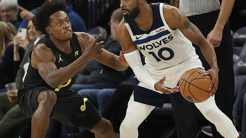 Nov 30, 2023; Minneapolis, Minnesota, USA; Utah Jazz guard Collin Sexton (2) defends against the Minnesota Timberwolves guard Mike Conley (10) in the fourth quarter at Target Center. Mandatory Credit: Bruce Kluckhohn-USA TODAY Sports