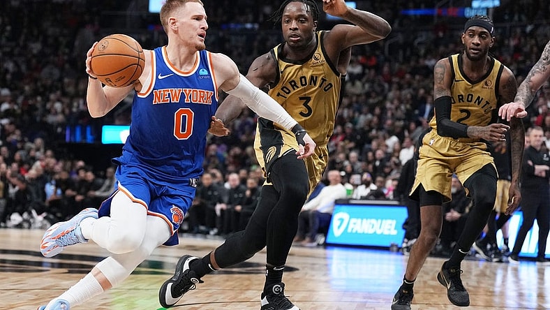 Dec 1, 2023; Toronto, Ontario, CAN; New York Knicks guard Donte DiVincenzo (0) controls the ball as Toronto Raptors forward O.G. Anunoby (3) tries to defend during the second quarter at Scotiabank Arena. Mandatory Credit: Nick Turchiaro-USA TODAY Sports