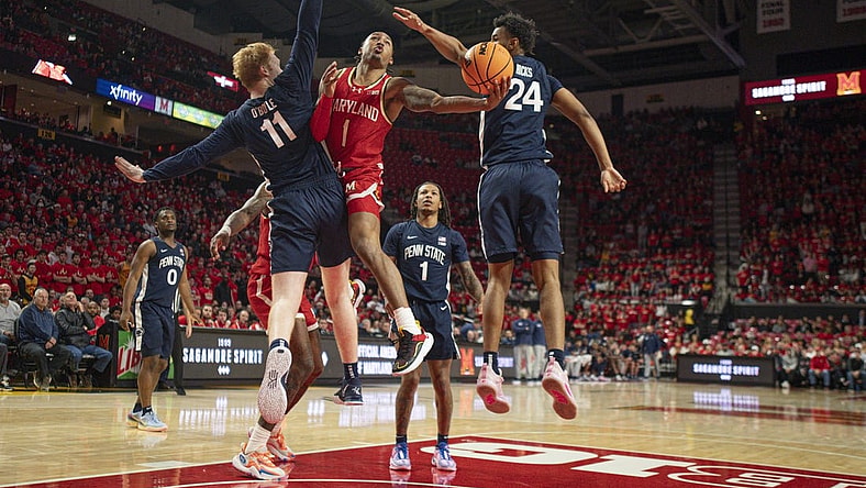 Dec 6, 2023; College Park, Maryland, USA;  Maryland Terrapins guard Jahmir Young (1) shoots around Penn State Nittany Lions forward Leo O'Boyle (11) during the second half at Xfinity Center. Mandatory Credit: Tommy Gilligan-USA TODAY Sports