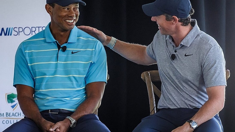 Tiger Woods and Rory McIlroy talk with Erin Andrews during a morning media event before groundbreaking ceremony at Palm Beach State College in Palm Beach Gardens, Fla., on February 20, 2023. It will be the future site of TGL, a new golf league played in a stadium and launched in partnership with the PGA.