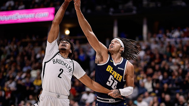 Dec 14, 2023; Denver, Colorado, USA; Brooklyn Nets forward Cam Johnson (2) and Denver Nuggets forward Aaron Gordon (50) battle for the ball in the third quarter at Ball Arena. Mandatory Credit: Isaiah J. Downing-USA TODAY Sports