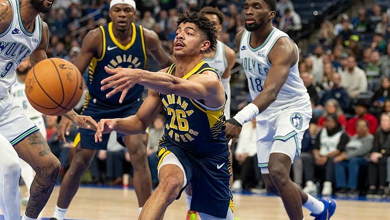 Dec 16, 2023; Minneapolis, Minnesota, USA; Indiana Pacers guard Ben Sheppard (26) passes the ball while defended by Minnesota Timberwolves guard Nickeil Alexander-Walker (9) in the fourth quarter at Target Center. Mandatory Credit: Matt Blewett-USA TODAY Sports