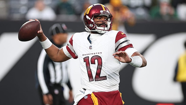 Dec 24, 2023; East Rutherford, New Jersey, USA; Washington Commanders quarterback Jacoby Brissett (12) throws the ball during the second half against the New York Jets at MetLife Stadium. Mandatory Credit: Vincent Carchietta-USA TODAY Sports