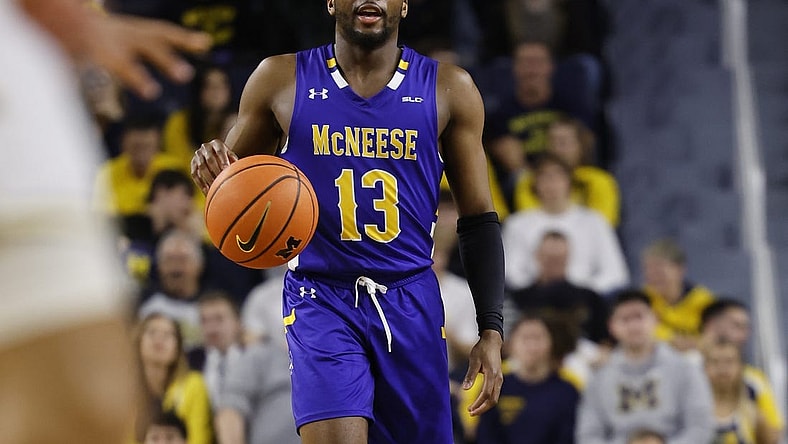 Dec 29, 2023; Ann Arbor, Michigan, USA;  McNeese State Cowboys guard Shahada Wells (13) dribbles in the second half against the Michigan Wolverines at Crisler Center. Mandatory Credit: Rick Osentoski-USA TODAY Sports