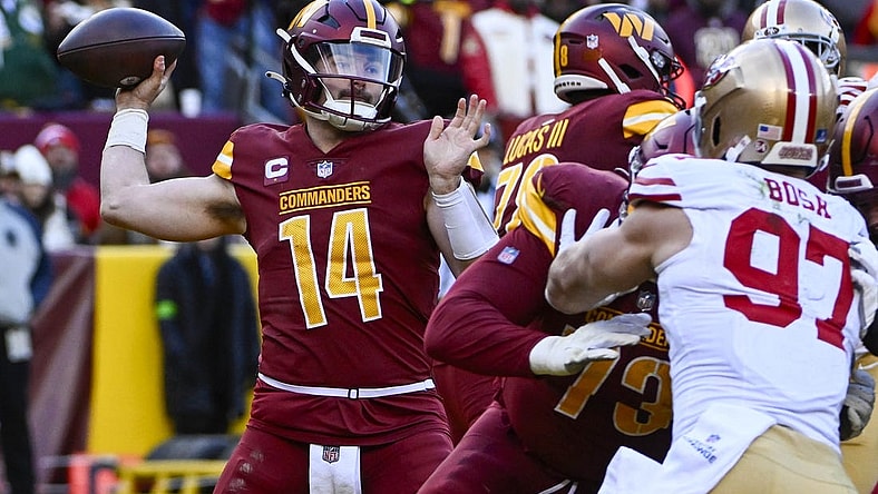 Dec 31, 2023; Landover, Maryland, USA; Washington Commanders quarterback Sam Howell (14) attempts a pass against the San Francisco 49ers during the second half at FedExField. Mandatory Credit: Brad Mills-USA TODAY Sports