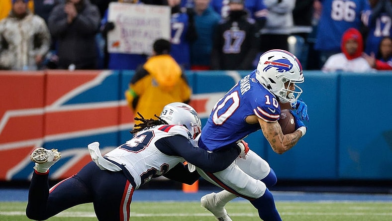 Buffalo Bills wide receiver Khalil Shakir (10) is tackled by New England Patriots safety Kyle Dugger (23) after a catch.