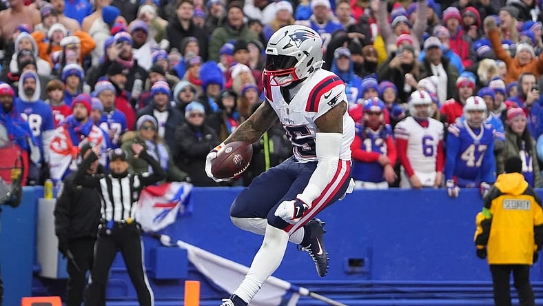 Dec 31, 2023; Orchard Park, New York, USA; New England Patriots running back Ezekiel Elliott (15) reacts to scoring a touchdown against the Buffalo Bills during the second half at Highmark Stadium. Mandatory Credit: Gregory Fisher-USA TODAY Sports
