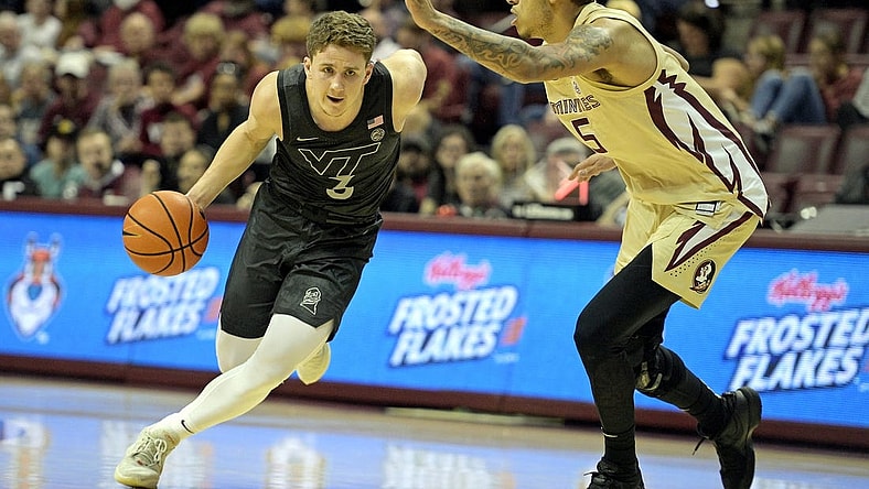 Jan 6, 2024; Tallahassee, Florida, USA; Virginia Tech Hokies guard Sean Pedulla (3) drives past Florida State Seminoles forward De Ante Green (5) during the first half at Donald L. Tucker Center. Mandatory Credit: Melina Myers-USA TODAY Sports