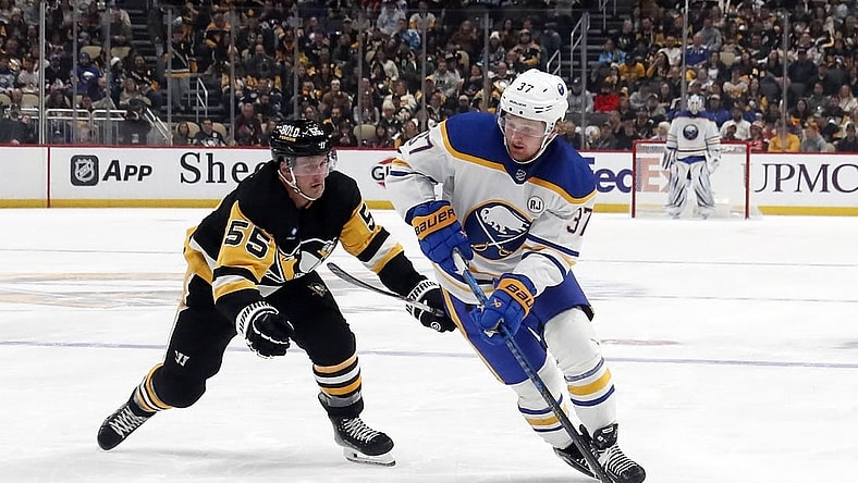 Jan 6, 2024; Pittsburgh, Pennsylvania, USA;  Buffalo Sabres center Casey Mittelstadt (37) skates with the puck against Pittsburgh Penguins center Noel Acciari (55) during the second period at PPG Paints Arena. Buffalo won 3-1. Mandatory Credit: Charles LeClaire-USA TODAY Sports