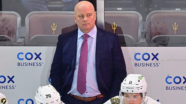 Jan 9, 2024; Tempe, Arizona, USA; Boston Bruins head coach Jim Montgomery looks on in the first period against the Arizona Coyotes at Mullett Arena. Mandatory Credit: Matt Kartozian-USA TODAY Sports