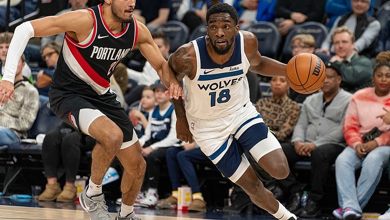 Jan 12, 2024; Minneapolis, Minnesota, USA; Minnesota Timberwolves guard Shake Milton (18) is defended by Portland Trail Blazers forward Justin Minaya (24) in the fourth quarter at Target Center. Mandatory Credit: Matt Blewett-USA TODAY Sports