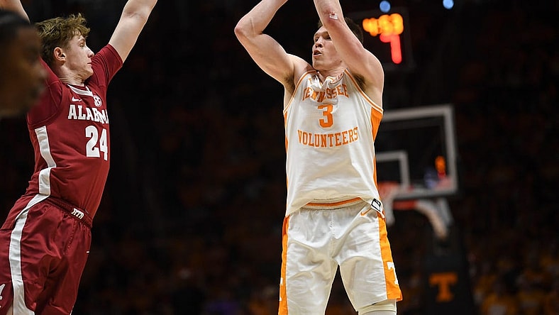 Tennessee guard Dalton Knecht (3) shoots the ball as Alabama forward Sam Walters (24) blocks during the NCAA game at Thompson-Boling Arena at Food City Center, Saturday, Jan. 20, 2024.