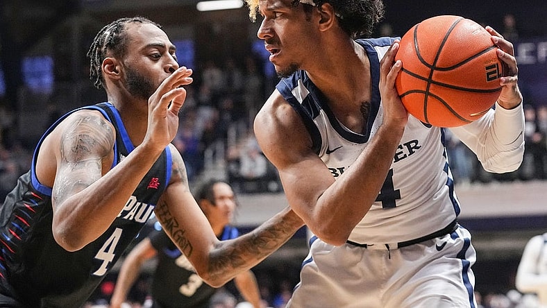 Butler Bulldogs guard DJ Davis (4) holds the ball from DePaul Blue Demons guard K.T. Raimey (4) on Saturday, Jan. 20, 2024, during the game at Hinkle Fieldhouse in Indianapolis. The Butler Bulldogs defeated the DePaul Blue Demons, 74-60.