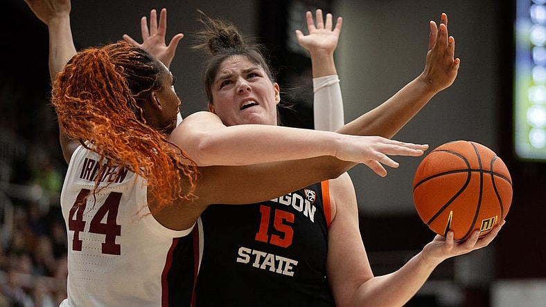 Jan 21, 2024; Stanford, California, USA; Oregon State Beavers forward Raegan Beers (15) tries to shoot over Stanford Cardinal forward Kiki Iriafen (44) during the first quarter at Maples Pavilion. Mandatory Credit: D. Ross Cameron-USA TODAY Sports