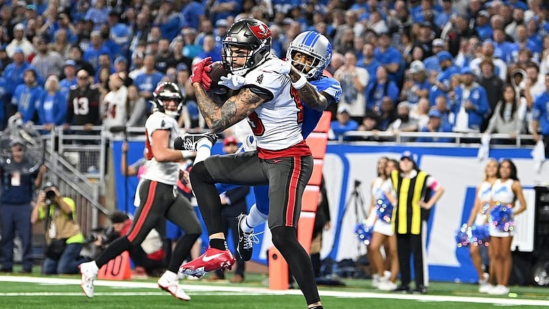 Jan 21, 2024; Detroit, Michigan, USA; Tampa Bay Buccaneers wide receiver Mike Evans (13) makes a catch against Detroit Lions cornerback Cameron Sutton (1) during the second half in a 2024 NFC divisional round game at Ford Field. Mandatory Credit: Lon Horwedel-USA TODAY Sports
