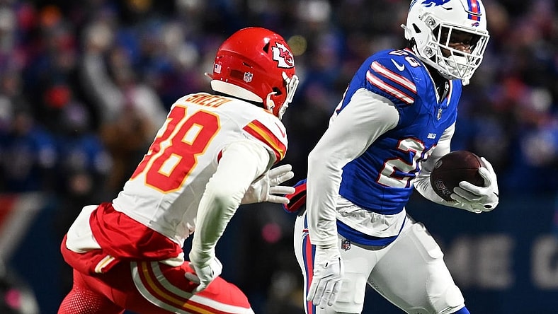Jan 21, 2024; Orchard Park, New York, USA; Buffalo Bills running back Latavius Murray (28) rushes the ball against  Kansas City Chiefs cornerback L'Jarius Sneed (38)in the first half of the 2024 AFC divisional round game at Highmark Stadium. Mandatory Credit: Mark Konezny-USA TODAY Sports