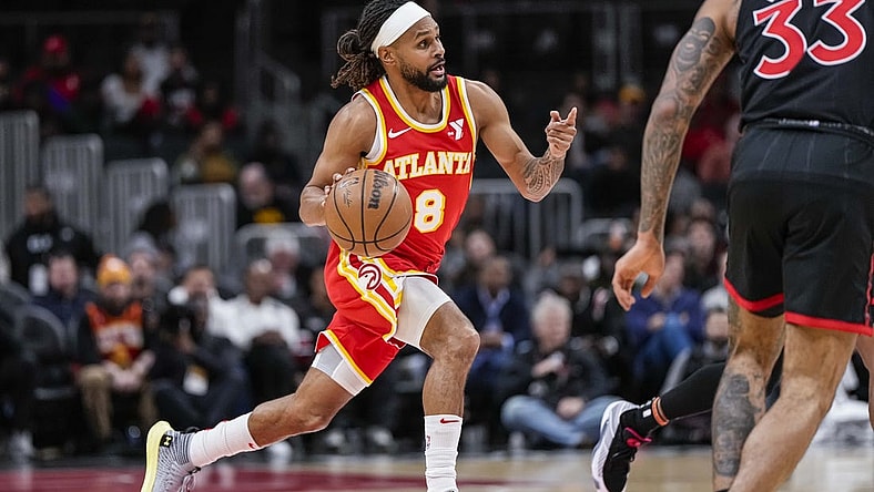 Jan 28, 2024; Atlanta, Georgia, USA; Atlanta Hawks guard Patty Mills (8) brings the ball up the court against the Toronto Raptors during the first half at State Farm Arena. Mandatory Credit: Dale Zanine-USA TODAY Sports
