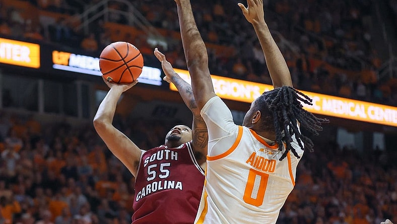 Jan 30, 2024; Knoxville, Tennessee, USA; South Carolina Gamecocks guard Ta'Lon Cooper (55) goes to the basket against Tennessee Volunteers forward Jonas Aidoo (0) during the second half at Thompson-Boling Arena at Food City Center. Mandatory Credit: Randy Sartin-USA TODAY Sports
