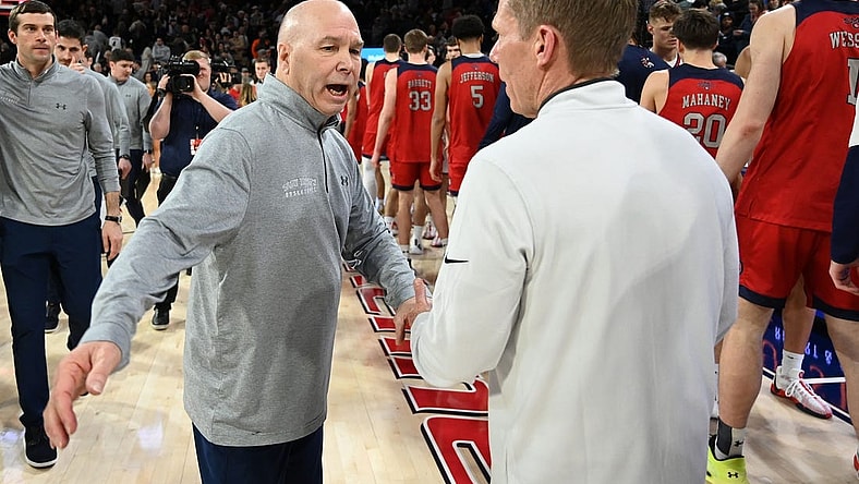 Feb 3, 2024; Spokane, Washington, USA; St. Mary's Gaels head coach Randy Bennett meets with Gonzaga Bulldogs head coach Mark Few after a game at McCarthey Athletic Center. St. Mary's Gaels won 64-62. Mandatory Credit: James Snook-USA TODAY Sports