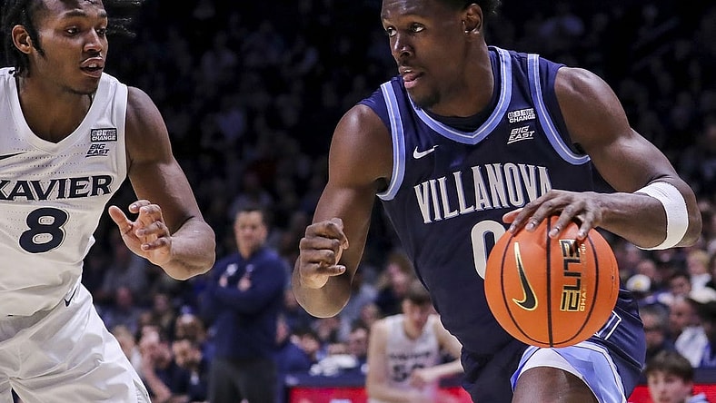 Feb 7, 2024; Cincinnati, Ohio, USA; Villanova Wildcats guard TJ Bamba (0) dribbles against Xavier Musketeers guard Quincy Olivari (8) in the second half at Cintas Center. Mandatory Credit: Katie Stratman-USA TODAY Sports