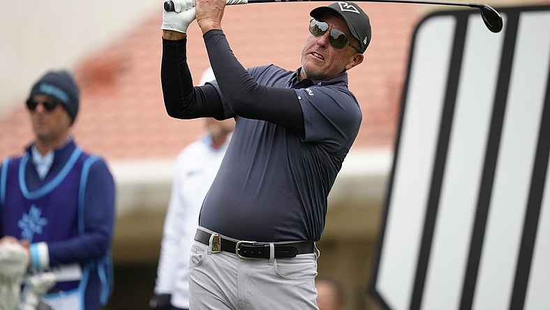 Feb 9, 2024; Las Vegas, Nevada, USA; Phil Mickelson plays his shot from the 11th tee during the second round of the LIV Golf Las Vegas tournament at Las Vegas Country Club. Mandatory Credit: Lucas Peltier-USA TODAY Sports