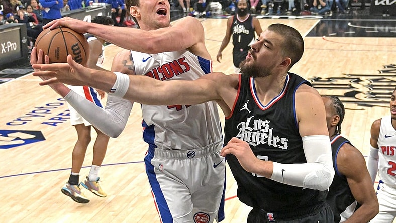 Feb 10, 2024; Los Angeles, California, USA;  Detroit Pistons center Mike Muscala (41) reaches in front of Los Angeles Clippers center Ivica Zubac (40) for a rebound in the first half at Crypto.com Arena. Mandatory Credit: Jayne Kamin-Oncea-USA TODAY Sports