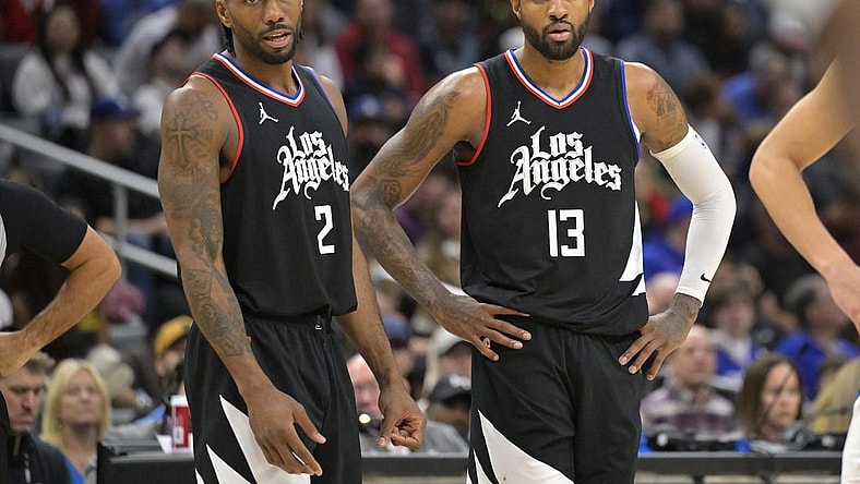 Feb 10, 2024; Los Angeles, California, USA;   Los Angeles Clippers forward Kawhi Leonard (2) and forward Paul George (13) look on in the second half against the Detroit Pistons at Crypto.com Arena. Mandatory Credit: Jayne Kamin-Oncea-USA TODAY Sports