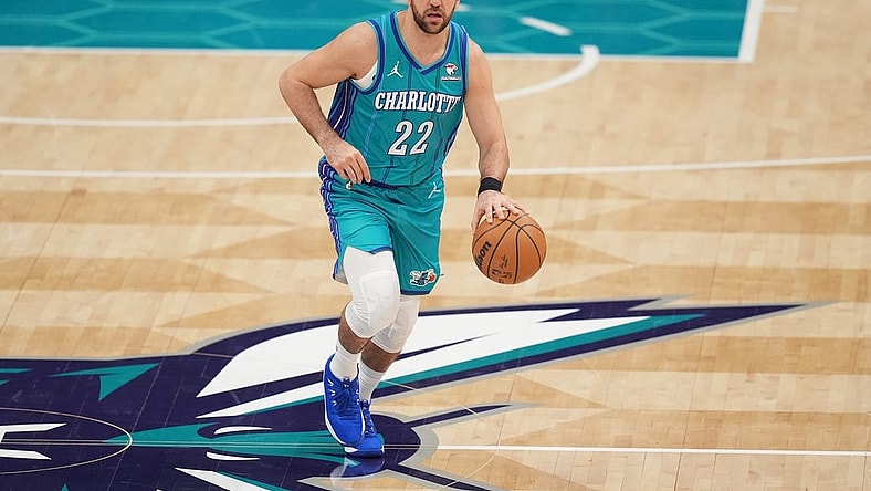 Feb 10, 2024; Charlotte, North Carolina, USA; Charlotte Hornets guard Vasilije Micic (22) brings the ball up court during the second quarter against the Memphis Grizzlies at Spectrum Center. Mandatory Credit: Jim Dedmon-USA TODAY Sports