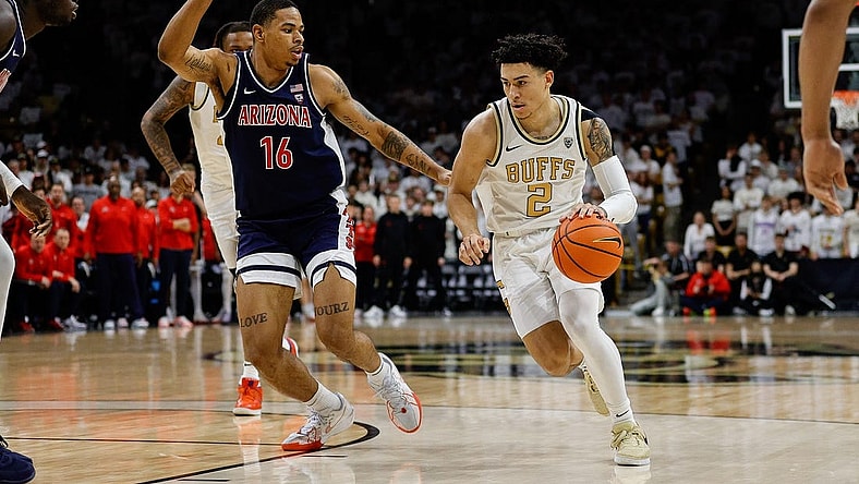 Feb 10, 2024; Boulder, Colorado, USA; Colorado Buffaloes guard KJ Simpson (2) controls the ball against Arizona Wildcats forward Keshad Johnson (16) in the second half at CU Events Center. Mandatory Credit: Isaiah J. Downing-USA TODAY Sports