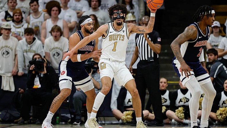 Feb 10, 2024; Boulder, Colorado, USA; Colorado Buffaloes guard J'Vonne Hadley (1) controls the ball against Arizona Wildcats guard Kylan Boswell (4) in the first half at CU Events Center. Mandatory Credit: Isaiah J. Downing-USA TODAY Sports