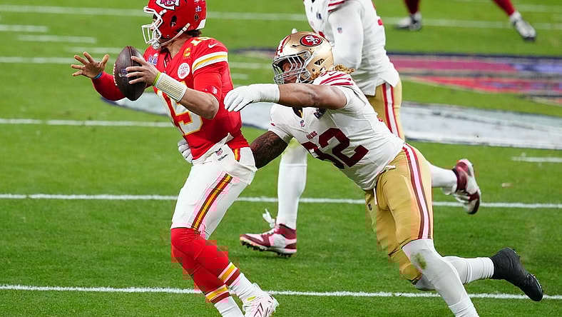 Feb 11, 2024; Paradise, Nevada, USA; Kansas City Chiefs quarterback Patrick Mahomes (15) is pressured by San Francisco 49ers defensive end Chase Young (92) in the first half in Super Bowl LVIII at Allegiant Stadium. Mandatory Credit: Stephen R. Sylvanie-USA TODAY Sports