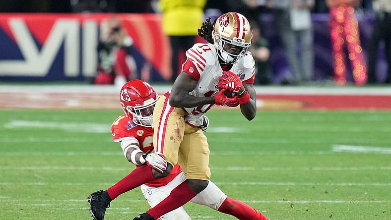 Feb 11, 2024; Paradise, Nevada, USA; Kansas City Chiefs safety Mike Edwards (21) tackles San Francisco 49ers wide receiver Brandon Aiyuk (11) during overtime of Super Bowl LVIII at Allegiant Stadium. Mandatory Credit: Kyle Terada-USA TODAY Sports