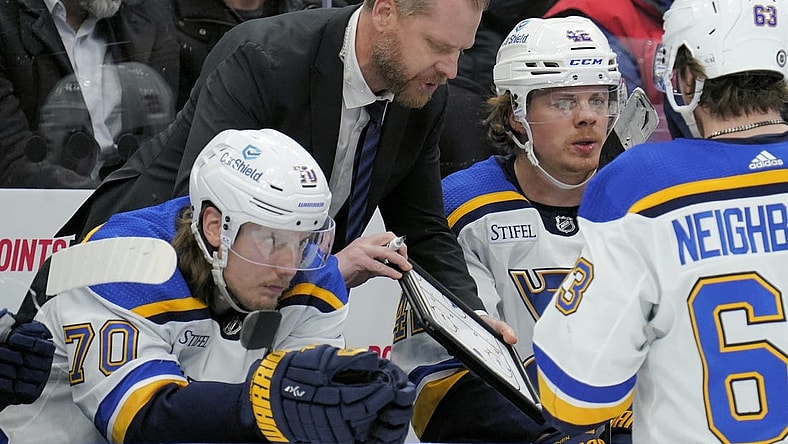 Feb 13, 2024; Toronto, Ontario, CAN; St. Louis Blues head coach Drew Bannister explains a play to his players during a break in the action against the Toronto Maple Leafs during the third period Scotiabank Arena. Mandatory Credit: John E. Sokolowski-USA TODAY Sports