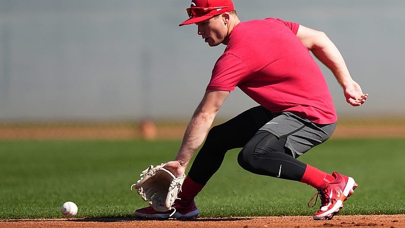 Cincinnati Reds shortstop Matt McLain (9) fields a groundball during spring training workouts, Wednesday, Feb. 14, 2024, at the team   s spring training facility in Goodyear, Ariz.