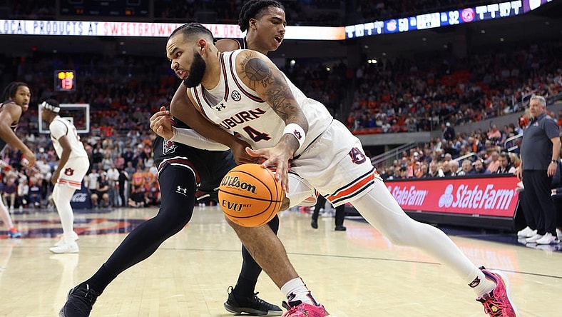 Feb 14, 2024; Auburn, Alabama, USA; South Carolina Gamecocks forward Collin Murray-Boyles (30) fouls Auburn Tigers forward Johni Broome (4) during the second half at Neville Arena. Mandatory Credit: John Reed-USA TODAY Sports
