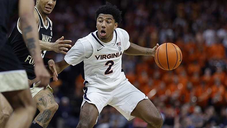 Feb 17, 2024; Charlottesville, Virginia, USA; Virginia Cavaliers guard Reece Beekman (2) drives to the basket as Wake Forest Demon Deacons guard Hunter Sallis (23) defends in the second half at John Paul Jones Arena. Mandatory Credit: Geoff Burke-USA TODAY Sports