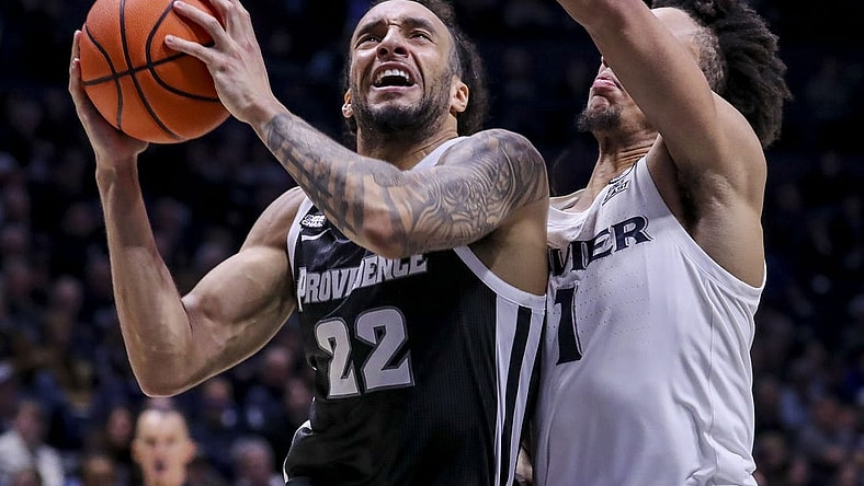 Feb 21, 2024; Cincinnati, Ohio, USA; Providence Friars guard Devin Carter (22) drives to the basket against Xavier Musketeers guard Desmond Claude (1) in the second half at Cintas Center. Mandatory Credit: Katie Stratman-USA TODAY Sports